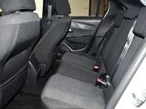 the back seats of a car with a remote control in it