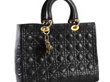 a black handbag with a gold chain on the handle
