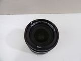 a close up of a camera lens on a white surface