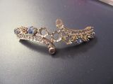 a picture of a pair of earrings that are on a table