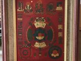 framed picture of a picture of a red and gold frame with a picture of a crown