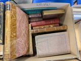 a box full of books sitting on a table