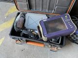a case with a laptop and other electronics inside of it