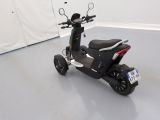 a scooter that is parked in a room