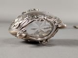 a silver ring with a clear crystal stone in it