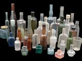 a lot of bottles that are sitting together on a table