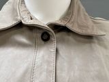 an image of a mannequin wearing a beige jacket