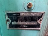 a sign on the side of a blue machine