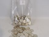 a bag full of coins sitting on a table