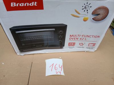 packaging of a brand new toaster oven sitting on top of a cardboard box