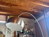 a lamp that is on top of a cabinet in a room