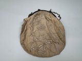 an image of a small purse with a flower design on it