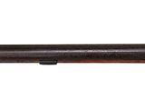 a shotgun with a wooden barrel on a white background