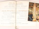an open book with a picture of a room in it