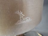 a lamp that has a picture of a deer on it
