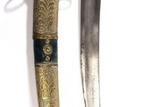 pair of old and worn knifes on a white surface with a keychain