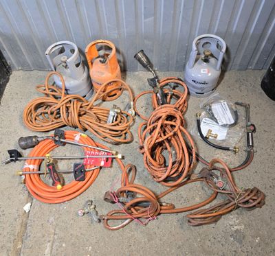 a lot of wires and tools that are on the ground
