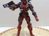 a deadpool figurine that is standing on a table