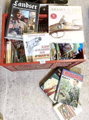many books in a red box on the floor