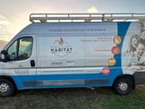 a van that is parked on the side of the road
