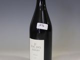 a bottle of wine that is sitting on a table