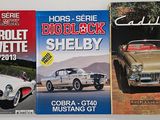 three books on display on the wall of a car showroom