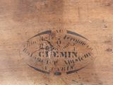 an old wooden box with a label on it