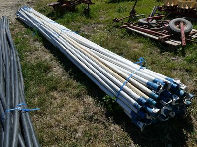 a lot of pipes laying on the ground next to each other