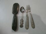 several spoons, forks and spoon rest on a white surface