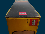 a box with a toy train in it on a blue background