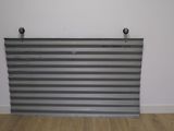 an image of a metal wall mounted to the side of a wall