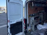 a white van that is parked in the parking lot