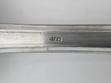 a close up of a spoon with a silver handle on a white surface