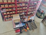 a pile of tools sitting on the floor next to a pile of boxes