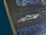 a box with a picture of a blue car in it