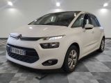 the white citrole is parked on a checkered floor