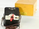 a box with a red handle and a black box with a red handle