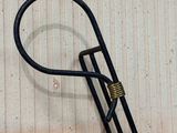 a black bike rack with a handle attached to it