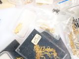 a lot of gold and silver jewelry on a table