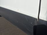 a white van parked on the side of the road
