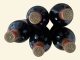 six bottles of wine sitting on top of each other