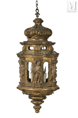 an image of a gold colored lantern hanging from a chain