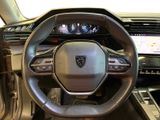the interior of a car with a steering wheel and dashboard controls