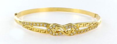 a gold bracelet with two hearts and diamonds on it