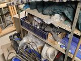 many tools and tools on the shelves in the garage