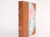 a small book that is sitting on a white surface
