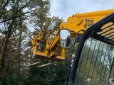 a construction vehicle that is sitting in the dirt