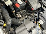 the engine of a car with its hood open and the hood down