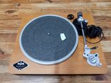 a turntable that is sitting on a wooden table