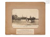 an old photo of a man on a horse in front of a line of soldiers
